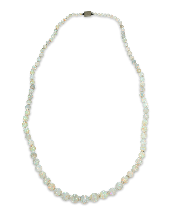 Eighty-nine opals of stunning color and quality create a brilliant rainbow in this necklace