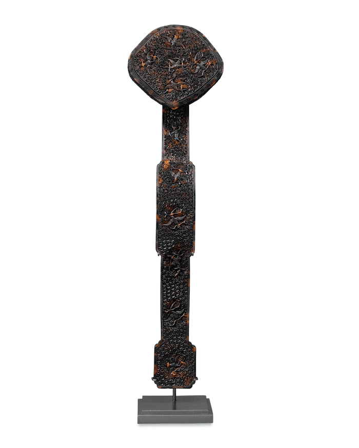 Fashioned from intricately carved tortoiseshell
