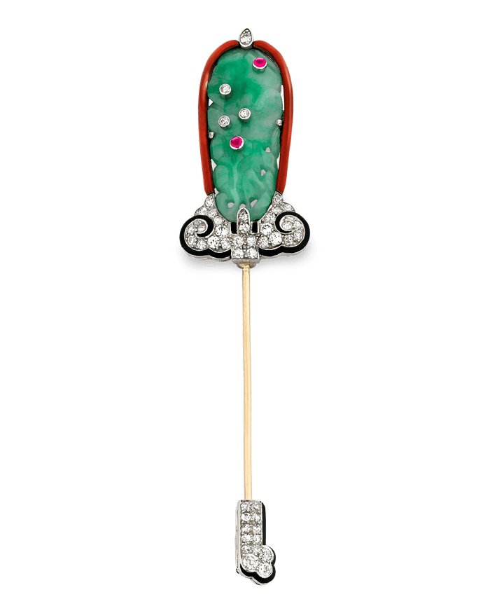 This exquisite jade jabot pin by Cartier epitomizes Art Deco era sophistication